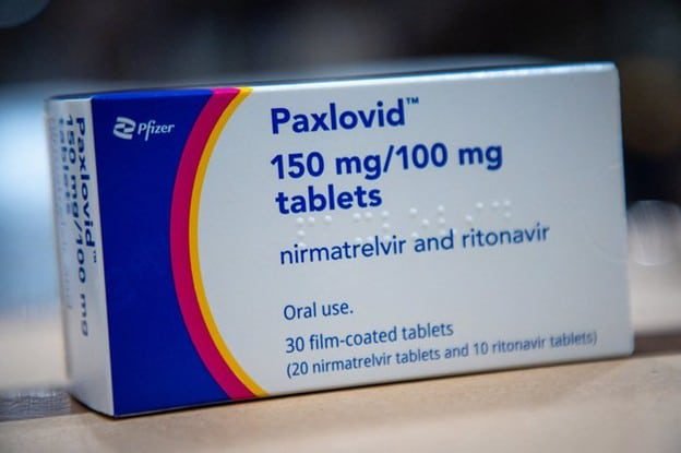 A box of Paxlovid 150 mg/100 mg tablets from Long Life Med in Las Vegas, containing nirmatrelvir and ritonavir for oral use, with 30 film-coated tablets shown on the label.
